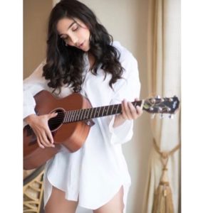 Halina-Kuchey-playing-guitar