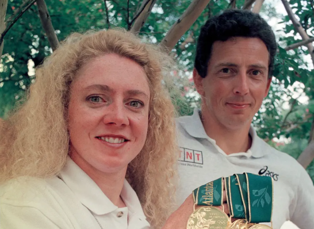 Irish swimmer Michelle Smith poses alongside her husband Erik de Bruin