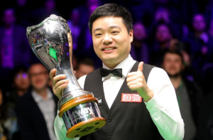 Ding Junhui holding his British Championship winner's trophy.